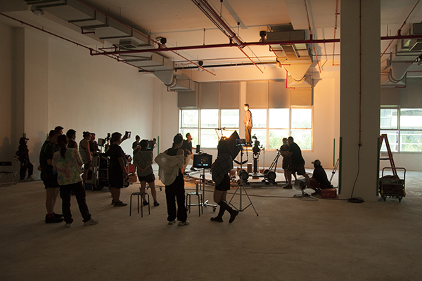 A video shoot with crew in an office space of Mustardseed@SG